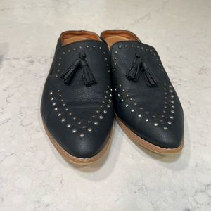 Black stuffed faux leather mules